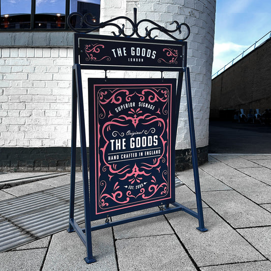 Traditional outdoor metal A board sign with decorative scrollwork.